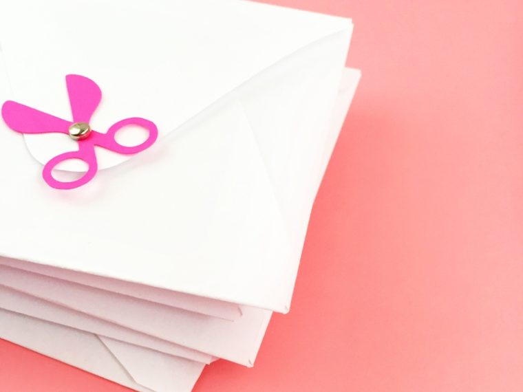 DIY Scissors Buttons On Envelopes - Maritza Lisa: Add a pair of scissors to your pretty envelopes or packages for all the crafters in your life. Grab some cardstock, a couple mini brads, fire up your Silhouette cutting machine and click through to make your own