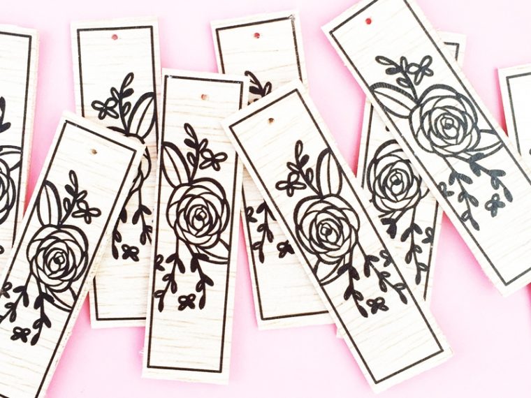 DIY Floral Wood Tags on Maritza Lisa - These floral tags were made with balsa wood, a floral image and Silhouette America's tattoo paper. Click through to make your own!