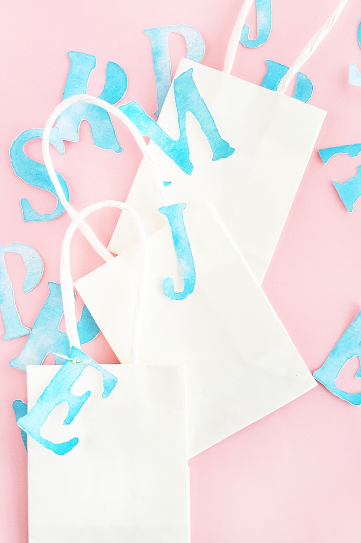 DIY Watercolor Letter Tags - Create your own watercolor letter tags for your packages, planners or memory books. Click through for the tutorial!