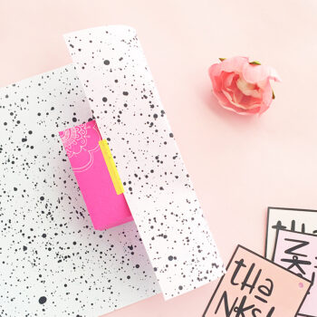DIY Super Easy Double Sided Paint Splattered Gift Wrap - Click through to make your own double-sided gift wrap with this easy tutorial on Maritza Lisa!