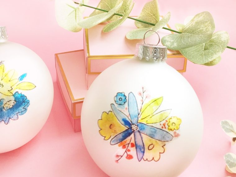 You can totally make these DIY Christmas Ornaments. I'll show you how with this easy tutorial using temporary tattoos! Perfect for your tree and as gifts!