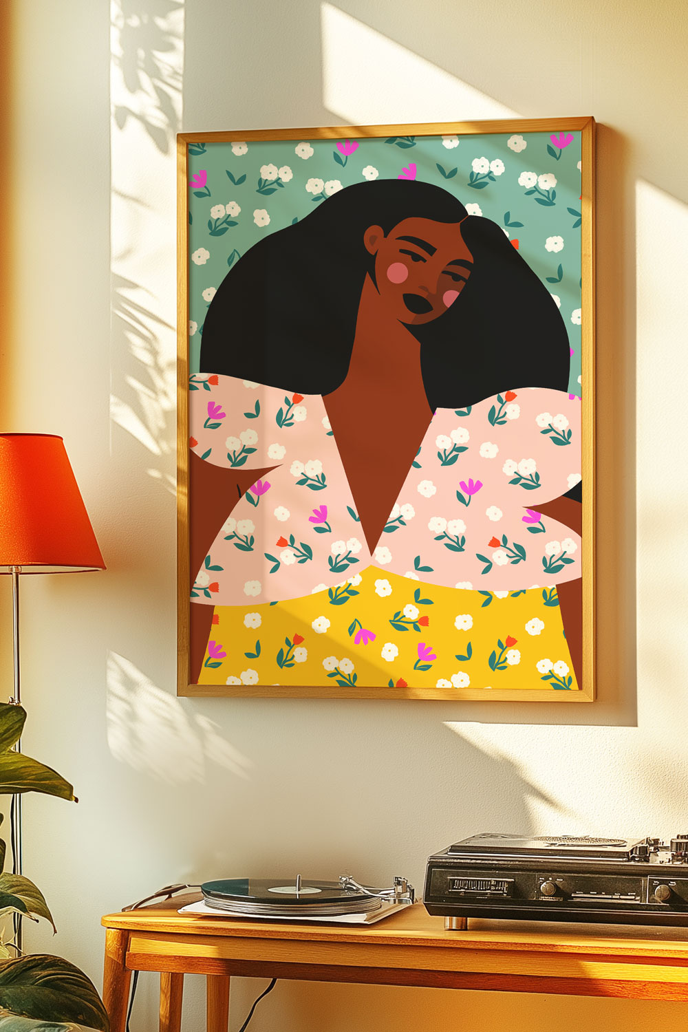Framed wall art of a floral portrait featuring a stylish Black woman with voluminous hair, displayed in a cozy, sunlit room with a record player and orange lamp.