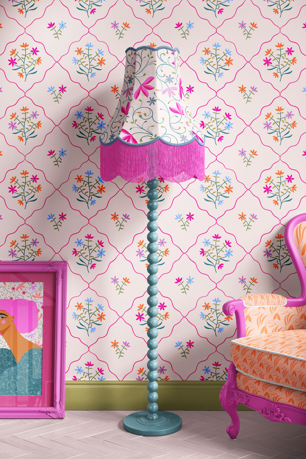 Interior mockup showing Spa Botanica wallpaper, a matching pink-and-floral patterned lampshade, a framed illustration from the collection, and a pink armchair, styled together to showcase the coordinating surface designs